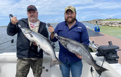 Two Coho Salmon, each measuring 23 inches, caught while fishing in NY