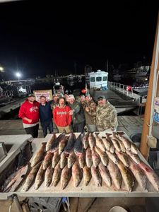 A group of 8 people fishing in LA