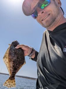 The thrill of OBX fishing, Sharing this Flounder!