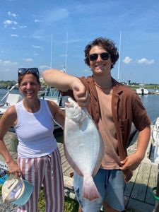 Nicole F and son reel in keepers for dinner!