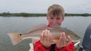 Child Fishing for Redfish in Florida