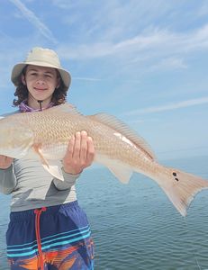 Kids enjoy redfish fishing in Florida!