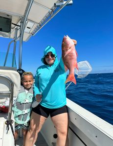 Mother & son whopping the fish