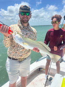 Sunset Bay Fishing: Redfish & Spotted Trout Action in South Padre