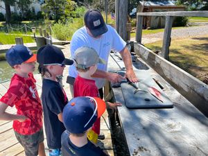 Kids Learning How to Clean Fish in Gwynn Island