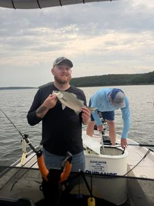 Hybrids and catfish came over the rail before weather rolled in, ending a memorable day on the water.