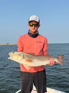 A memorable evening on the water with happy anglers and a rewarding catch.