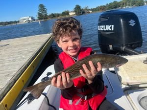 Young man catches nice Speckled Trout on Neuse. 
