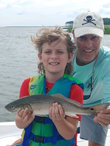 ￼ Solomon, age 9 gets a puppy drum on the Neuse. ￼