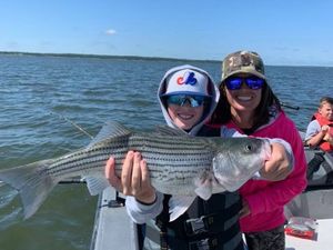 He can't believe he caught this big Striped Bass! 