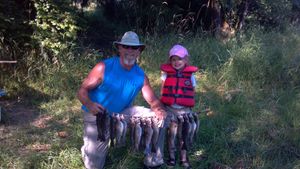 Family fishing moment with fresh catch for dinner