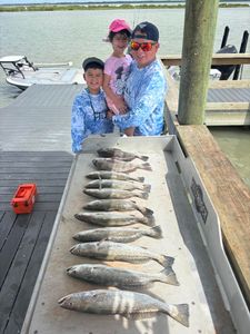 PJ and his kids enjoyed an action-packed morning as trout stayed active on croaker, with several upcoming dates still available to book.