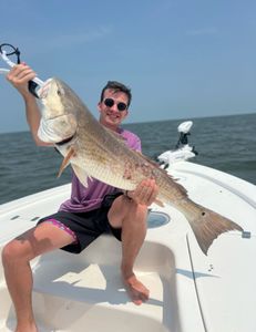 Chase redfish: Fishing triumph.