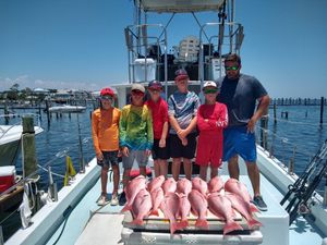 Group Fishing Enjoying Their Red Snapper