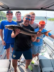 Georgie, Joel, and Family Reel in a Mixed Bag of Sturgeon, Walleye, Bass, and More