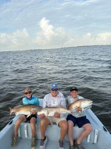Young Anglers Land a Triple of Trophy Redfish