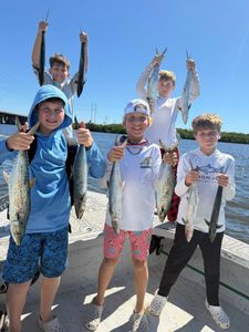 Hands Full with Five Excited Anglers – Fish Are Biting!