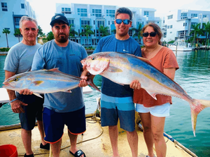 Expert Anglers In Miami With Their Amberjacks