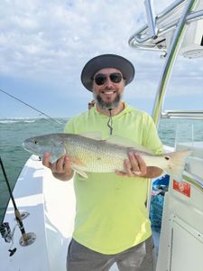 A productive day with slot drum, grouper, bluefish, triggerfish, and jumbo Spanish mackerel, though the search for the “man in the brown suit” came up