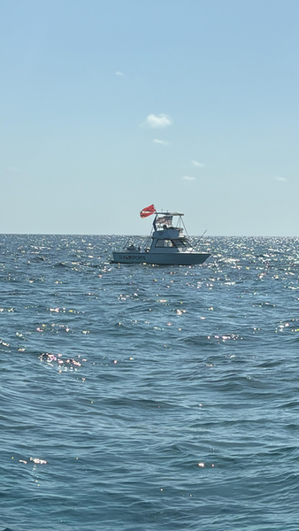 Red-flagged fishing boat cruises Key Largo waters.