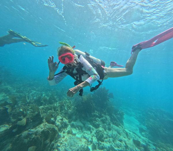 Exploring vibrant coral reefs beneath crystal clear waters.