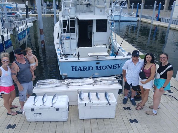 Family fishing success on Hard Money with a solid King Mackerel haul!