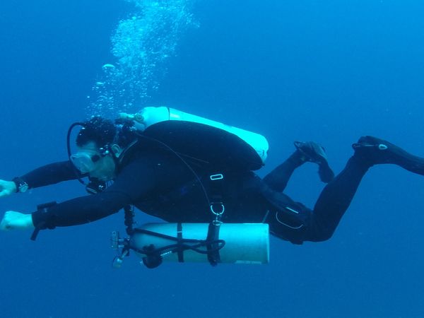 Exploring the underwater world through scuba diving adventure.