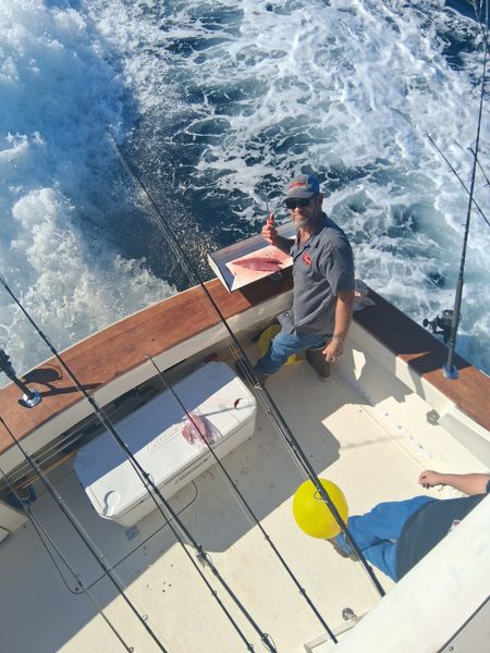 Landing fresh fish on a scenic California fishing trip