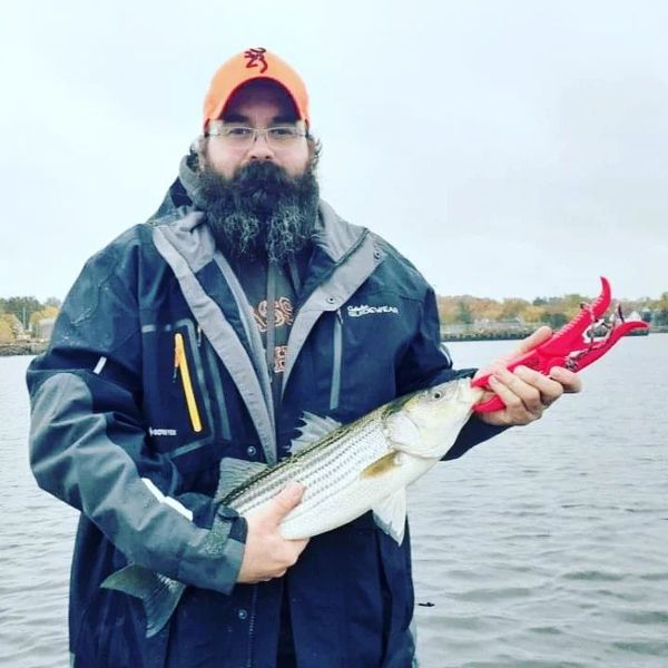 Striped Bass in hand, smile on face!!