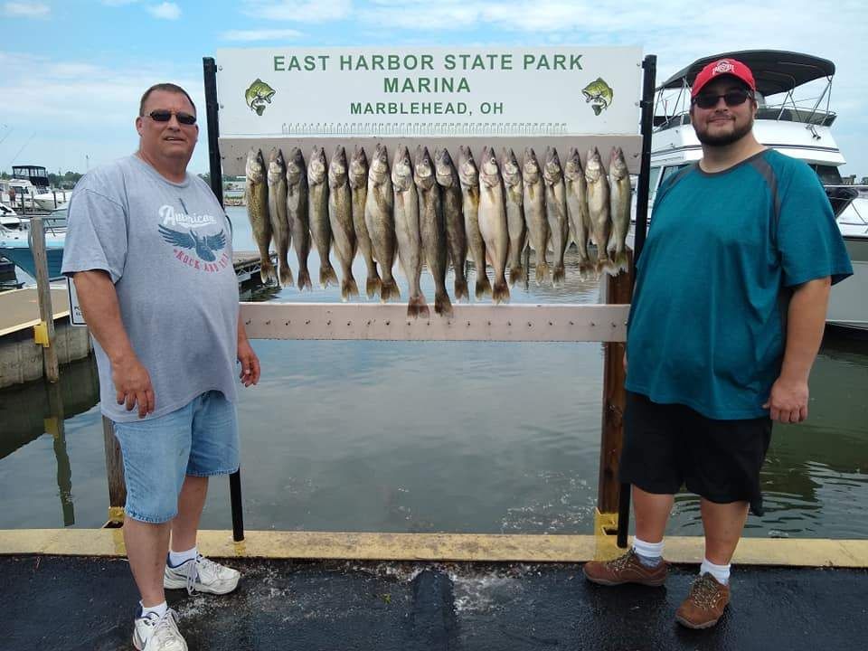 Two people fishing in a scenic location