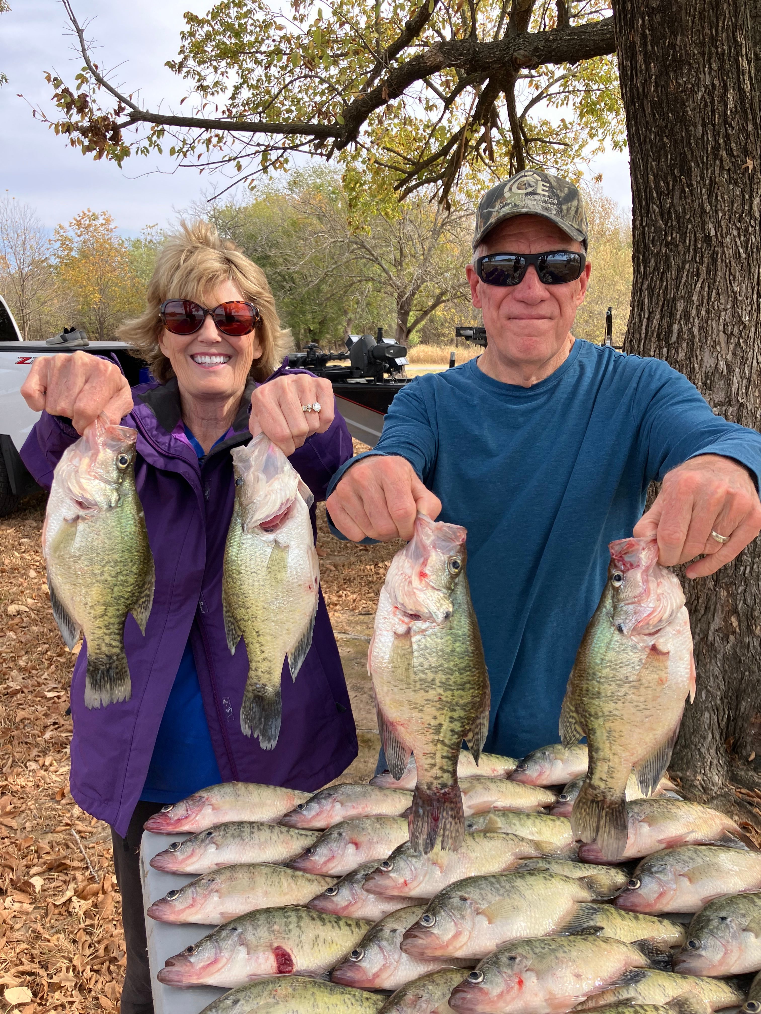 Six crappie fish caught by two people while fishing