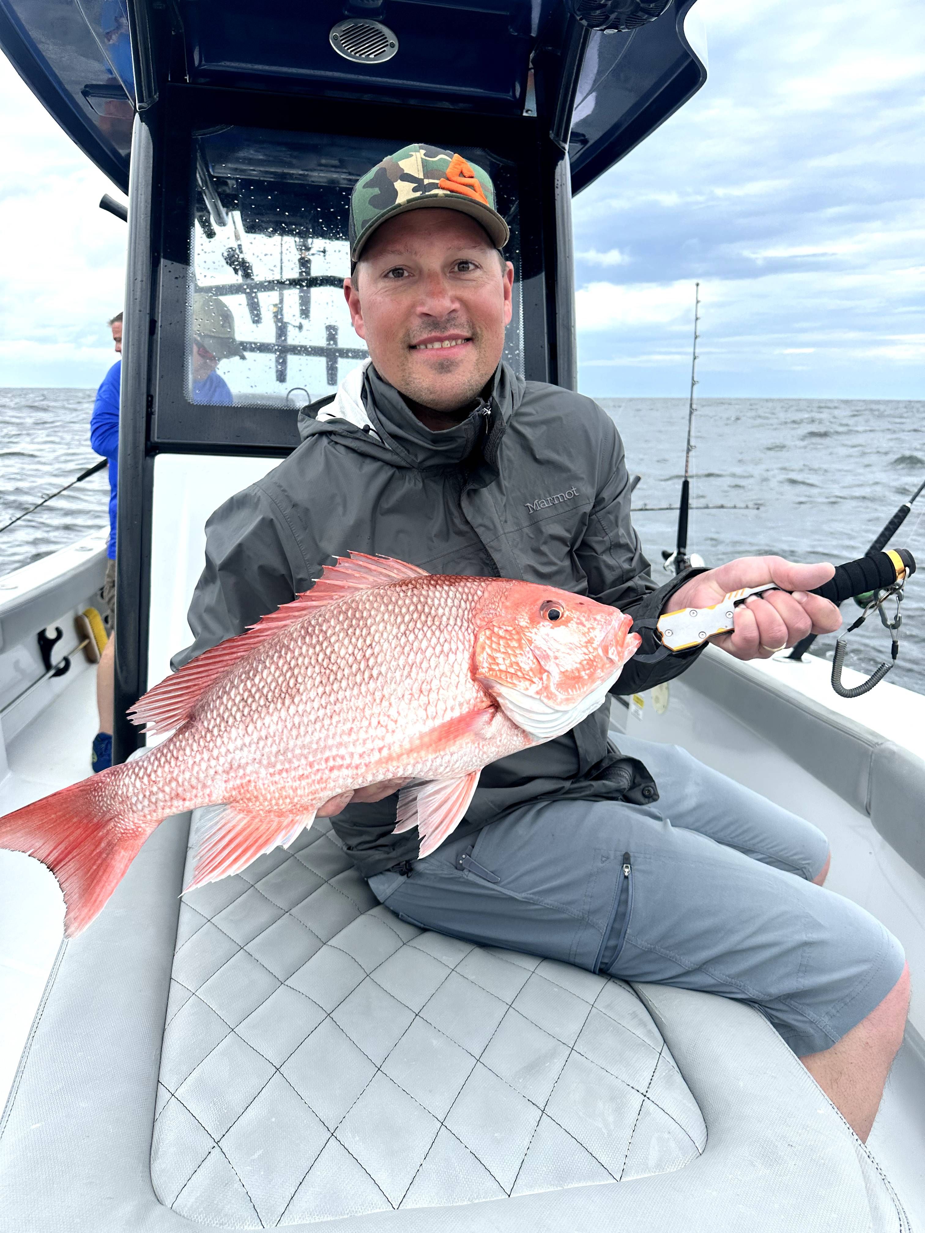 Red snapper caught while fishing on a boat in open water