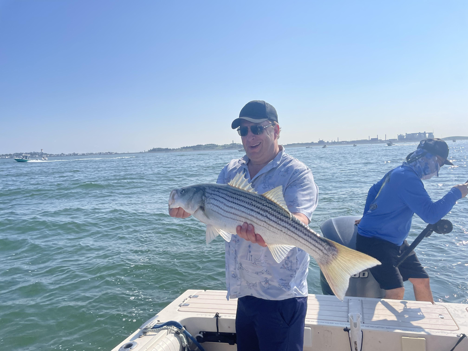 Big Striped Bass reeled in on a clear day!
