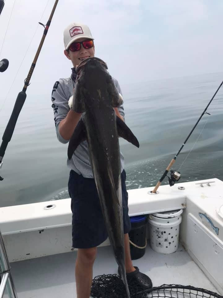 A lone angler fishing in an unknown location