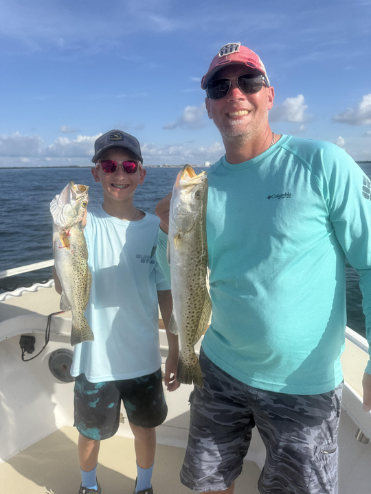 Huge Spotted Weakfish and Redfish caught in St. Petersburg's partly cloudy waters!