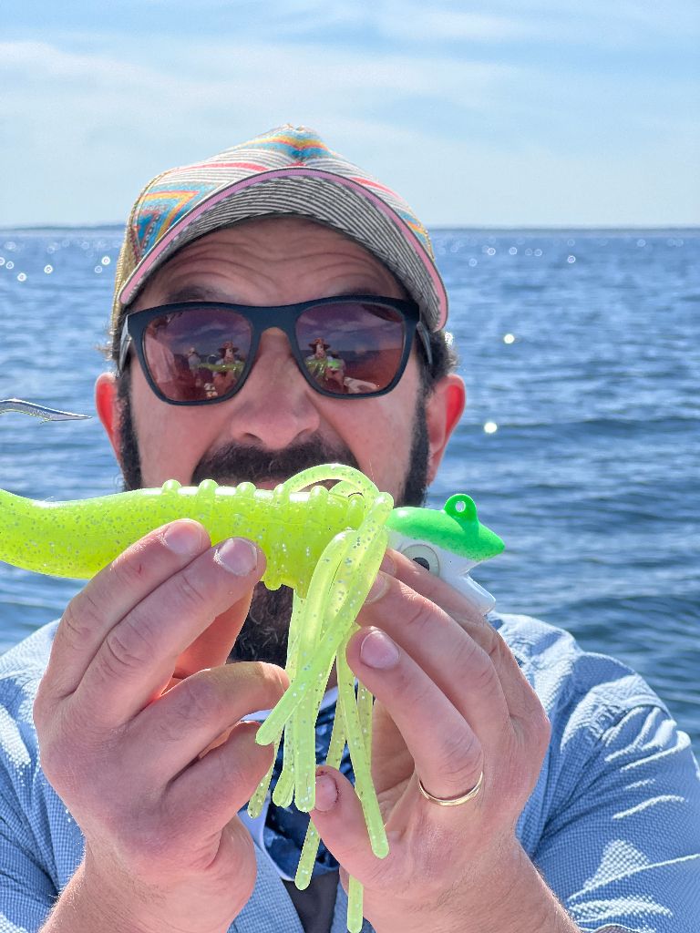 A person fishing in an unknown location