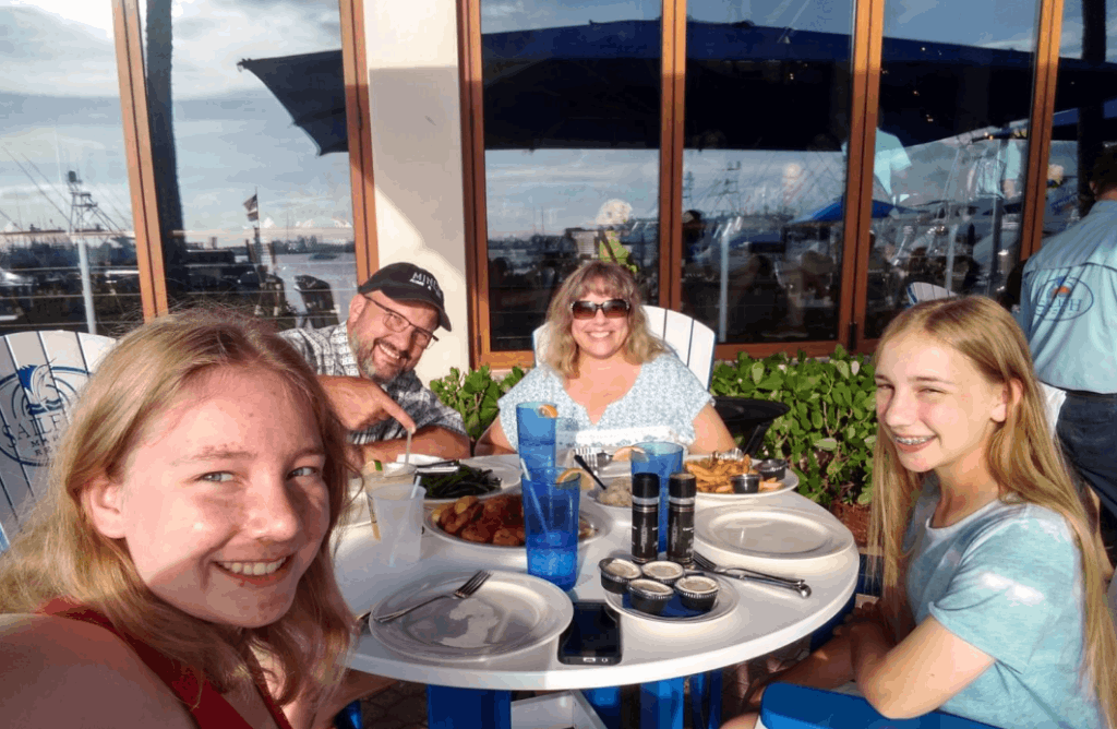 Four people fishing in an unknown location