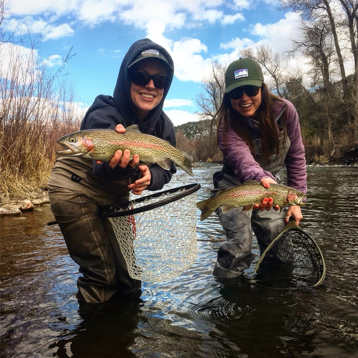 Rainbow trout action in the river today! Great fishing with nets.