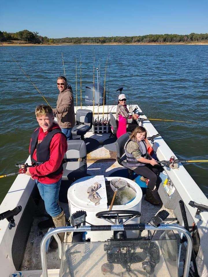 Four anglers fishing in a scenic location