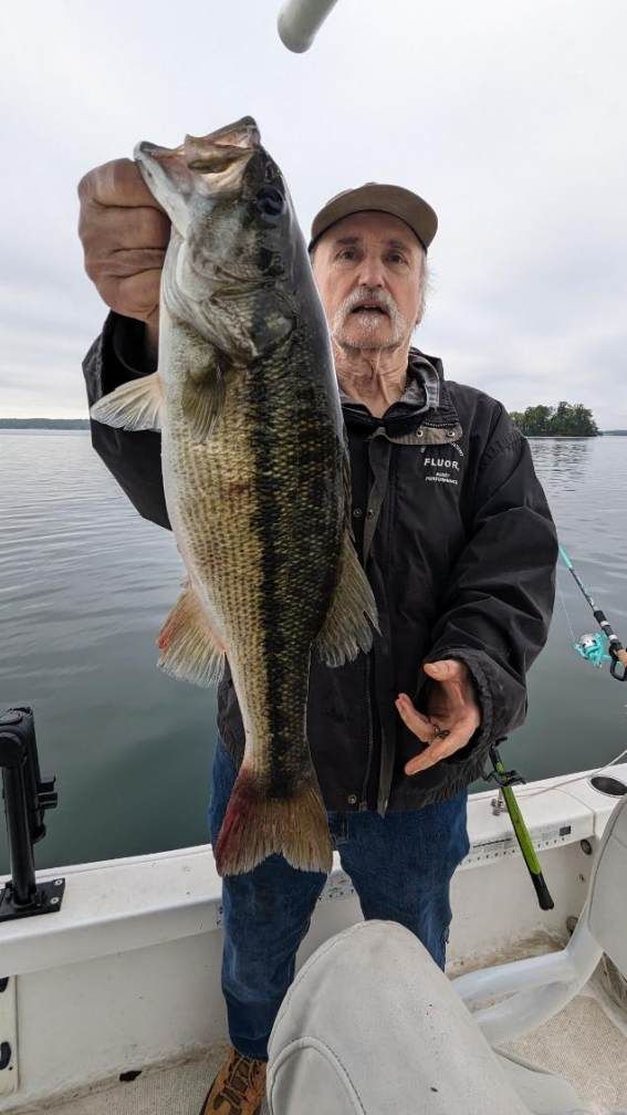 Fisherman with 29-inch catch at unknown location