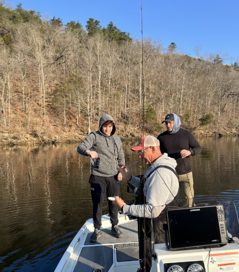 Two anglers enjoying a fishing trip at unknown location