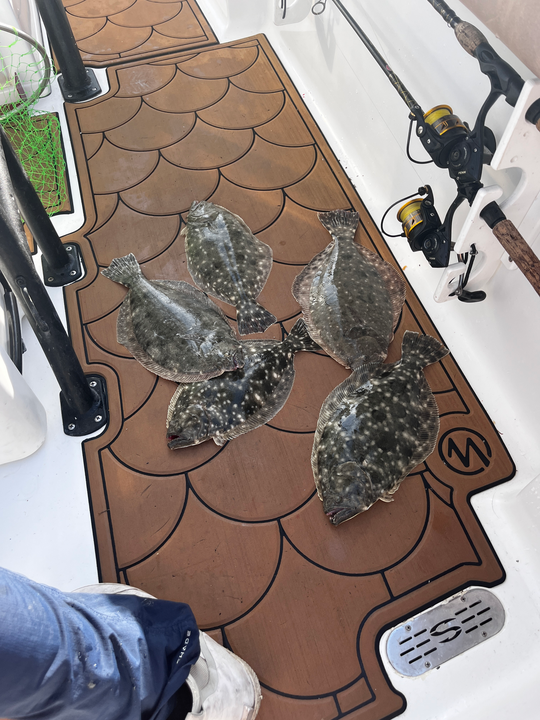 Nice flatfish using deep sea jigging and light tackle in clear conditions!