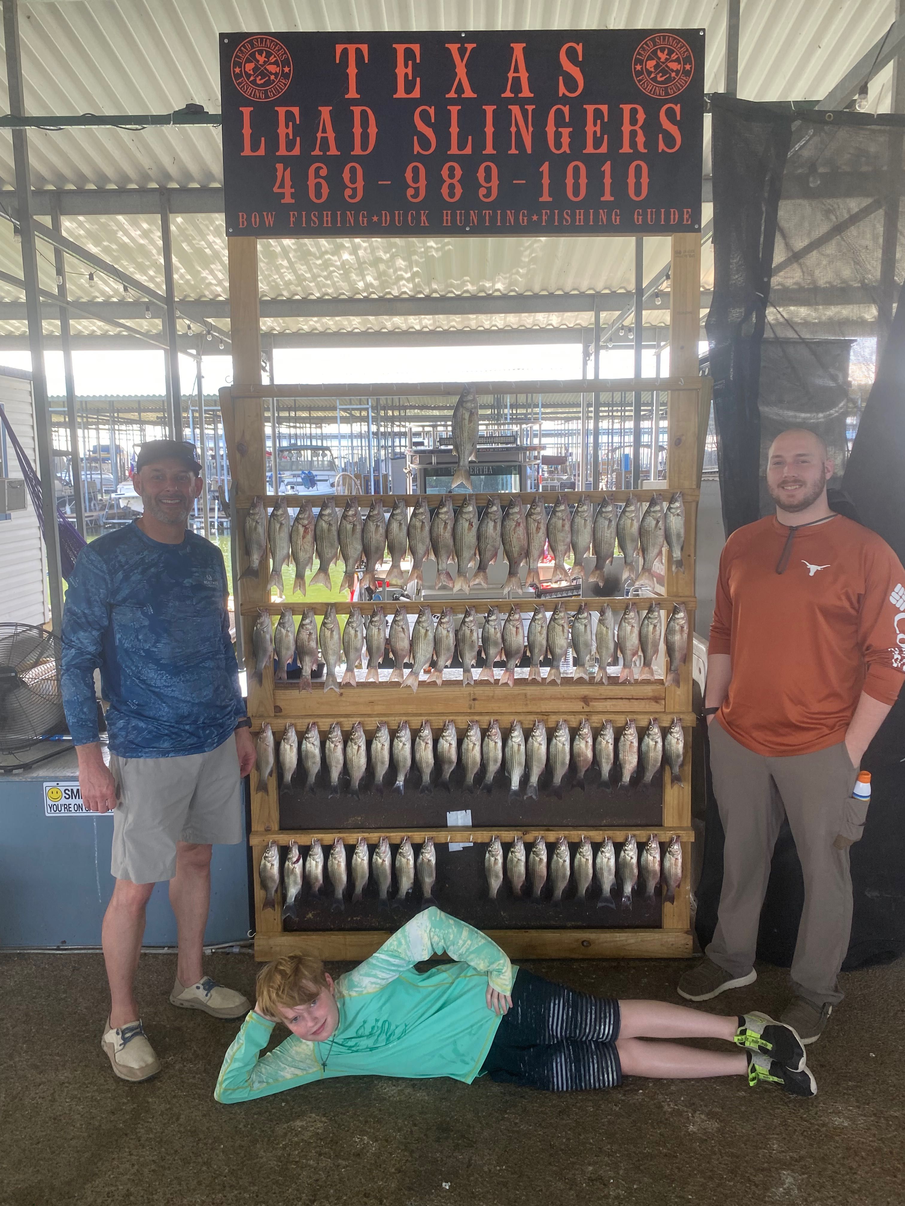 Three people fishing in a scenic location