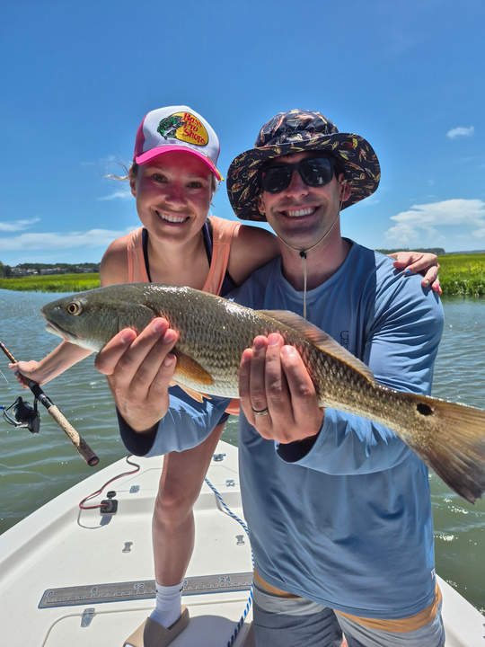 Big redfish hooked while jigging under stormy skies!