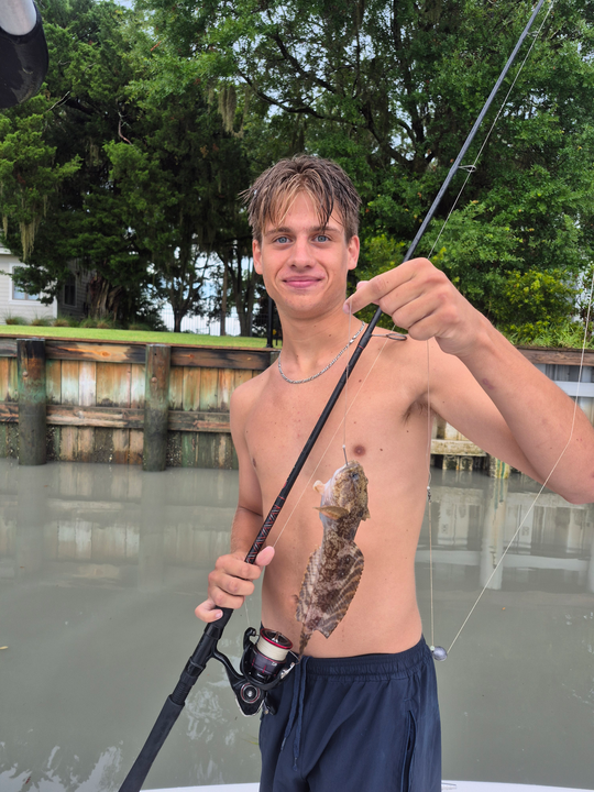 Reeling in an Oyster Toadfish while storms brew on the horizon!