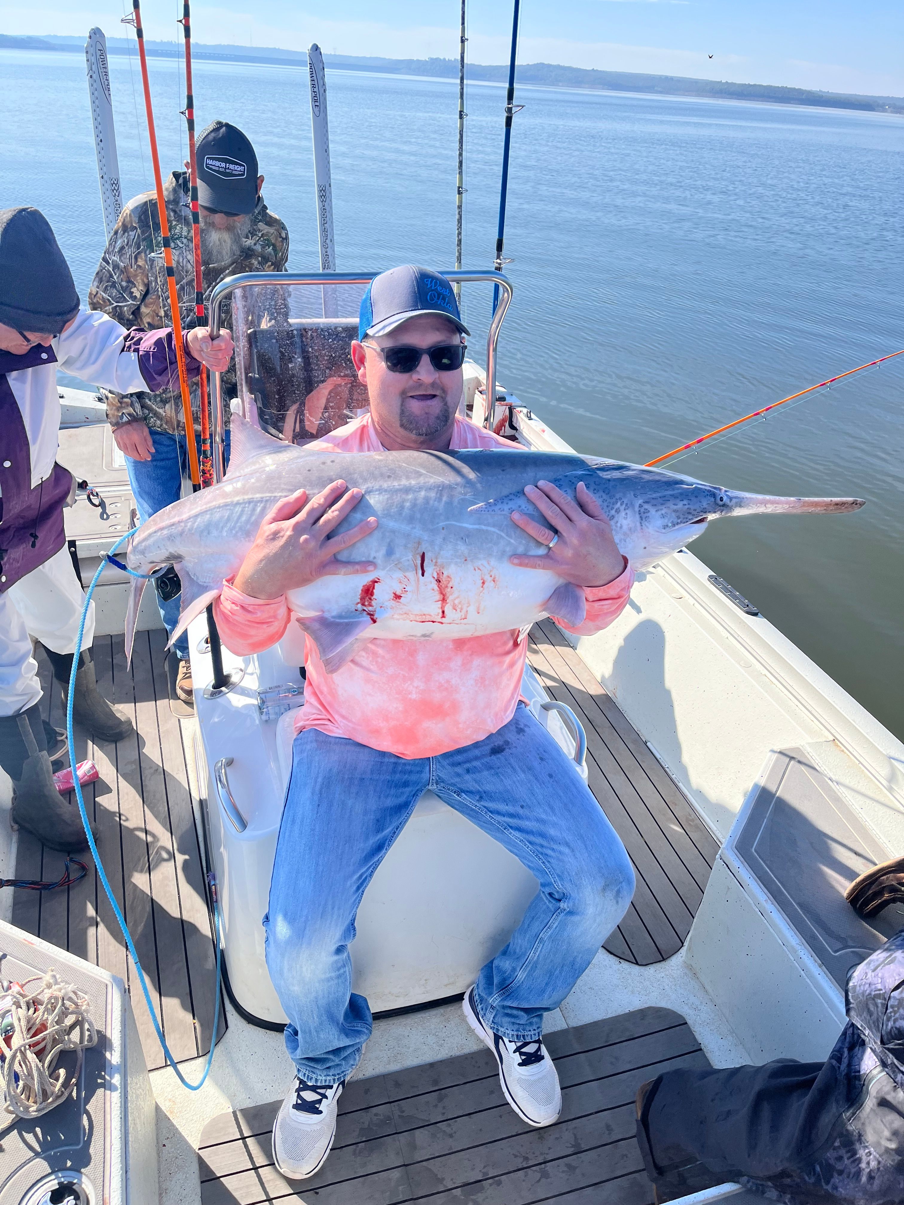 Large fish caught during offshore fishing trip on boat deck
