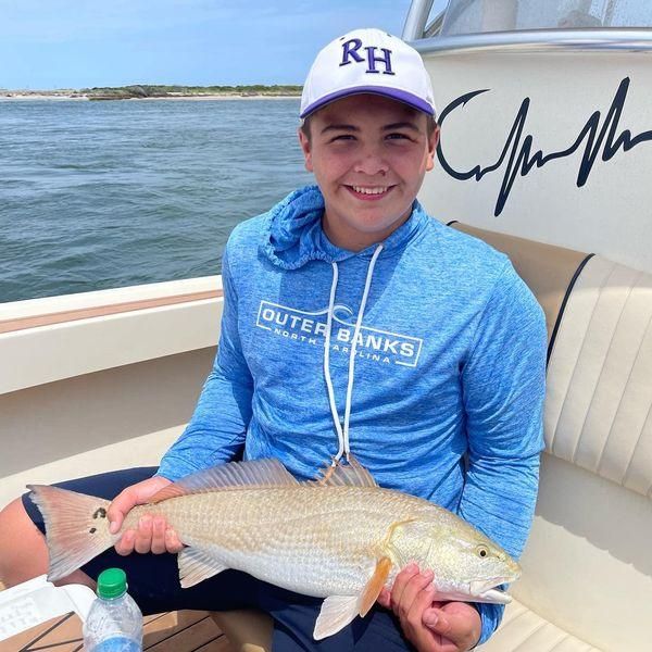 Fisherman with an 18-inch catch