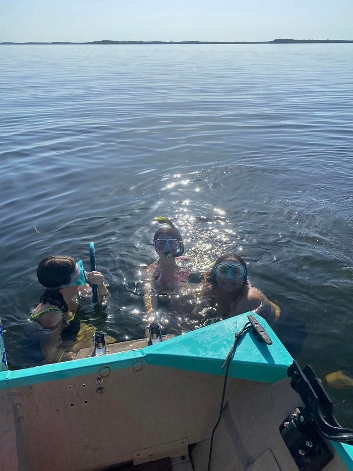 A person fishing in an unknown location