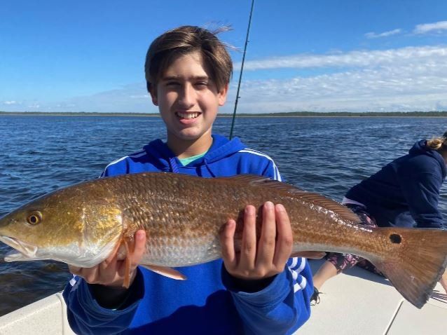 Lone angler fishing in unknown location