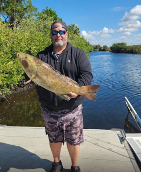Lone angler fishing in unknown location